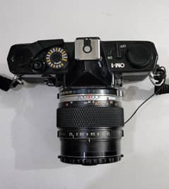 Olympus OM-1 with 55mm 1.2 SLR