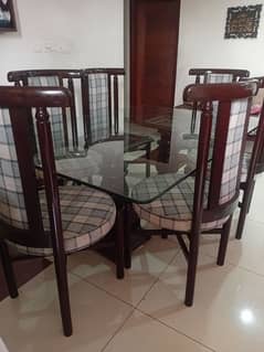 glass dining table with six chairs