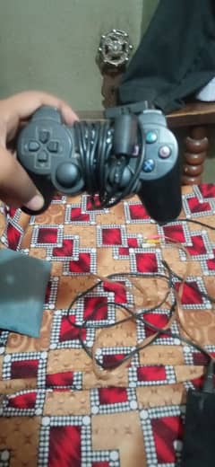 ps2 slim with two controllers jailbreak imported from Dubai