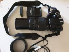 Nikon DSLR camera D3200 with 70-300mm lens with bag and charger.