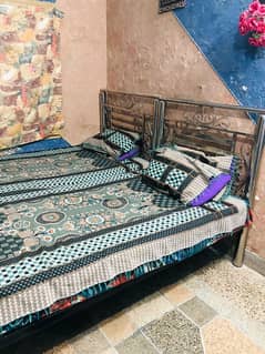 Two iron beds