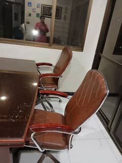 office table and revolving chairs
