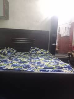 bed with mirror side table