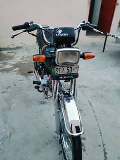 Honda 70 with STP 50 golden number