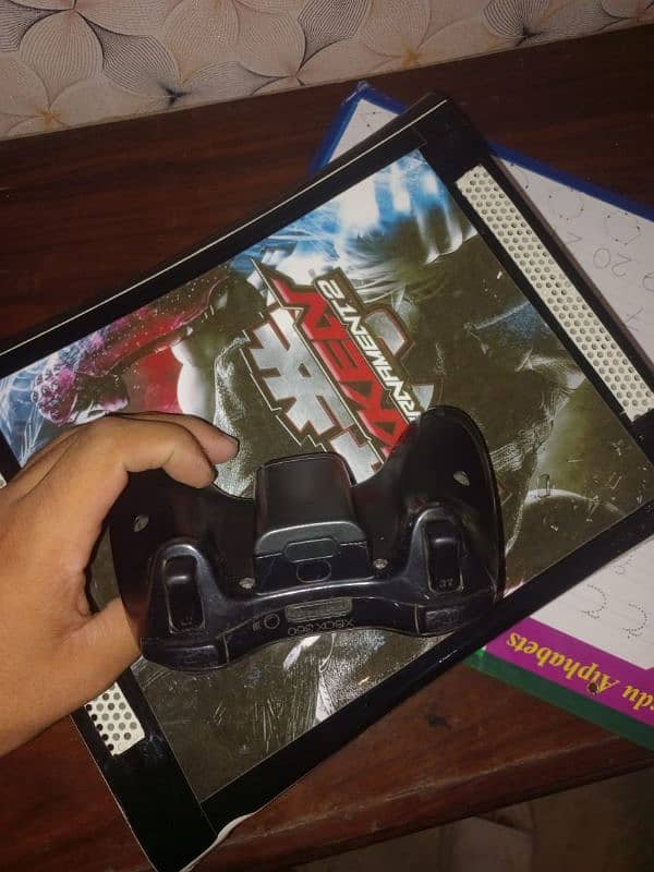 Xbox 360 with one original controller  and 80 games are installed 0