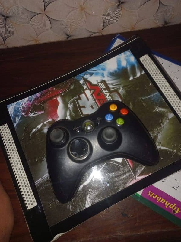 Xbox 360 with one original controller  and 80 games are installed 1