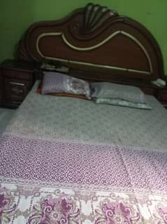 double bed with site tables and dressing table