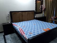 bedset with side tables and dressing table.