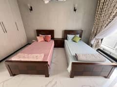 2 x single bed with one side table