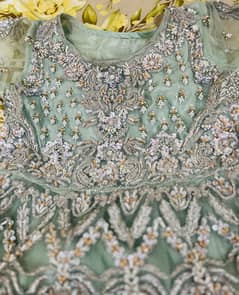 Mint green colour long maxi with work of beautiful flayer