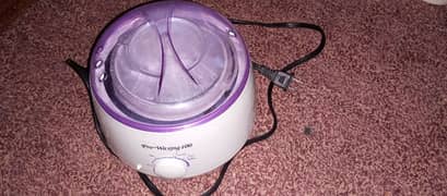 Wax heating machine
