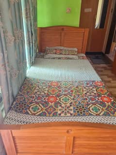 2 single bed with 1 side table