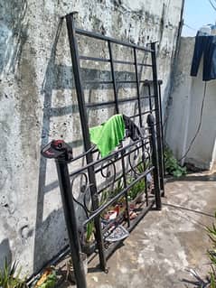 Iron bed for sale with a wooden sheet and mattress