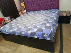 double bed with 2 side tables large mirror and console