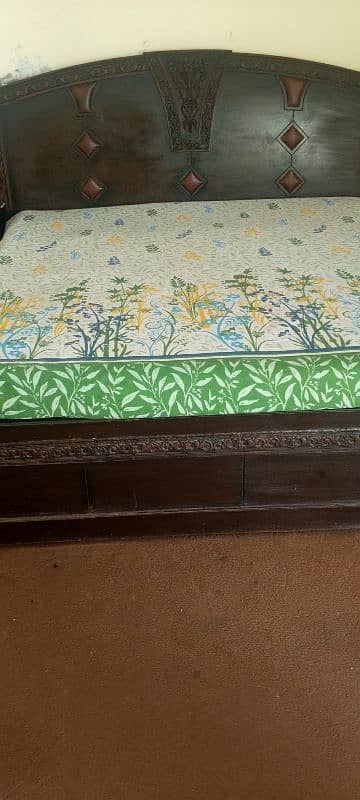 king size bed with stylish dressing table and side table. 0