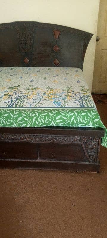 king size bed with stylish dressing table and side table. 1