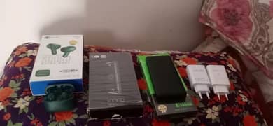 2 power bank's 20k mah 2 adopters fast charging and one ear dots danny