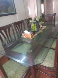 8 seater Dining Table with green curtains and Green Picture