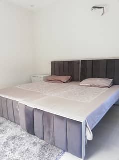 2 single bed with one side table