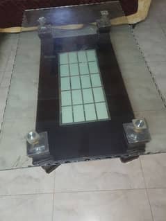 wooden central table . tempered glass