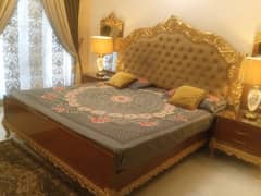 King bed with side table and dressing and wall mirror