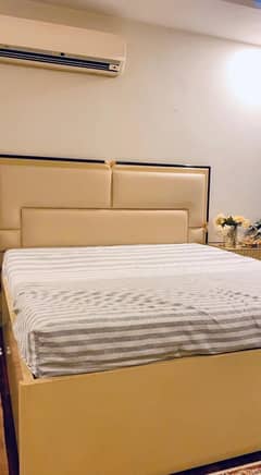King size bed with 2 side tables and one dressing table
