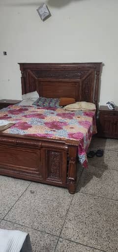 wooden bed sat