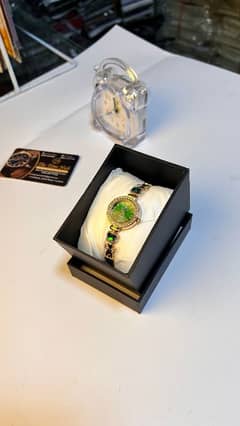Premium Women’s Watch – Gold Finish with Green Crystal Touch