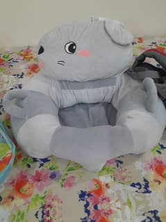 Baby support sitting from six months old children .