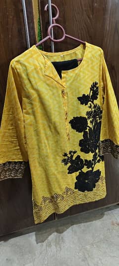beautiful yellow shirt with a bell bottom pearled trouser