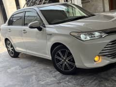 Toyota Corolla Axio Hybrid Pearl White