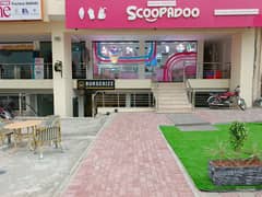 "Basement Shop for Rent in Sector A, Surrounded by Food Outlets Ideal for Food or Retail Business"