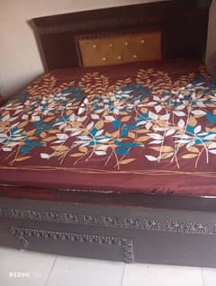 double bed with poshish on back side