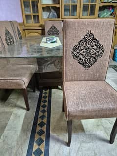 Elegant glass table with 6 dining chairs