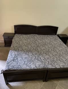 Wooden bed with two sidetables and dressing table
