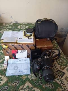 Nikon D3400 DSLR with 18-55mm Lens + Bag + Charger + SD Card