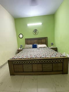 King size bed with side table