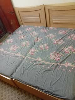 2 Single beds with mattresses
