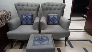 2 sofa chairs with table