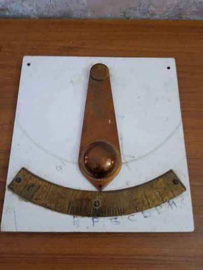 BRASS PENDULUM WALL MOUNTED .