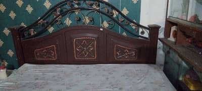 wood and iron bed