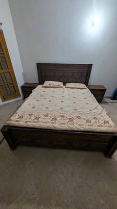 double bed king size with two side tables and dresser