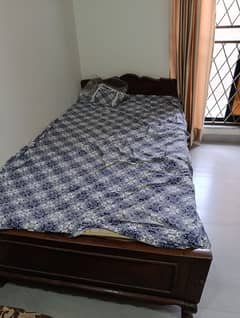 Solid wood single bed with metres for sale