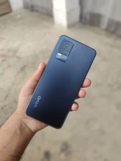 Vivo v21e with box, charger and back pouches.