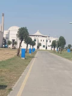 A block hot location 8 Marla Plot for sale possession paid utility paid near masjid and fifty fit good location