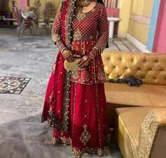 bridal lehnga bright red and green with golden kaam