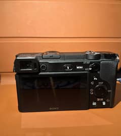 Sony A6400 with kit lens and other camera accessories