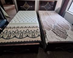 Two Single beds with side tables