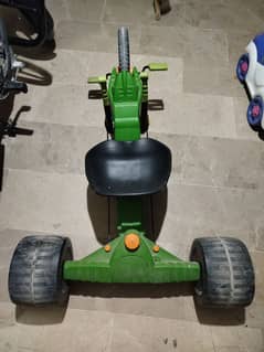 tri cycle . Huffy green machine