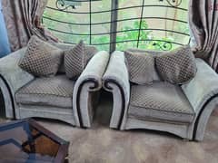 seven seater sofa with cushions and center table